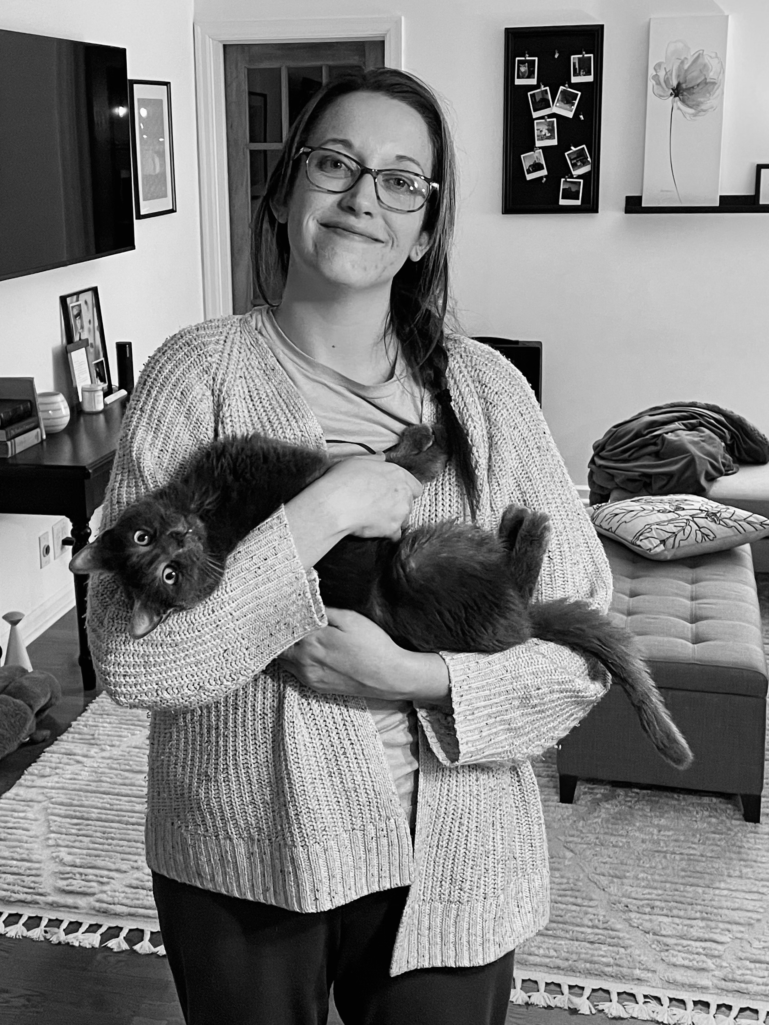 Katy Williams holding cat in home